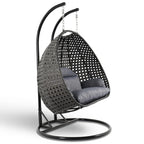 LeisureMod Sedia a Uovo Sospesa per 2 Persone con Supporto - Dondolo Pensile per Esterni/Interni in Rattan Intrecciato con Cuscini